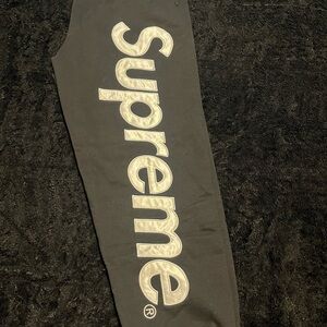 Supreme Black Joggers with Red Tag